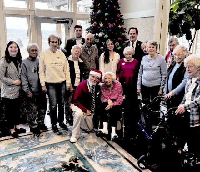 group of seniors posing for a photo at Christmas