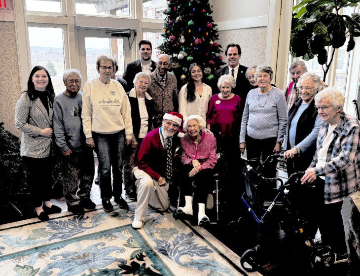 group of seniors posing for a photo at Christmas